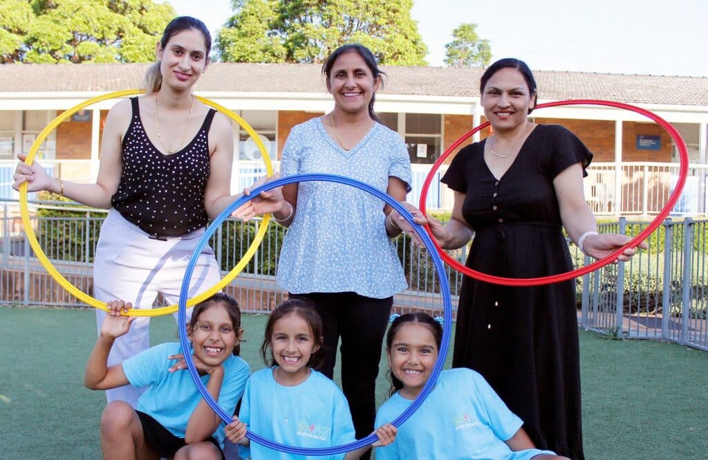 (Back row, left to right) Priyanka Kunner, Kulwinder Kaur and Rajwinder Kaur with their daughters (left to right) Nysha, Rehmatt and Jazzmeet all holding hula hoops.